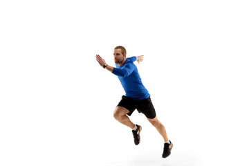 Fototapeta na wymiar To top. Caucasian professional jogger, runner training isolated on white studio background. Muscular, sportive man, emotional. Concept of action, motion, youth, healthy lifestyle. Copyspace for ad.