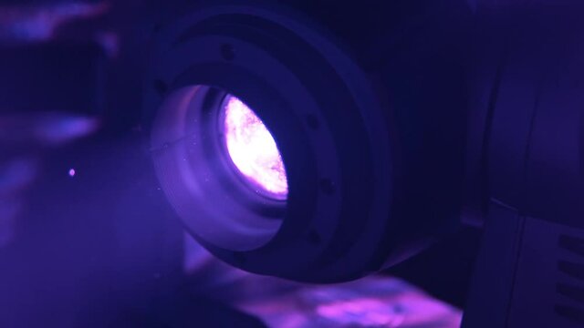 Blue soffit light and dust at gig. Concert light illumination. Party at the club. Shining rays rotating and making flare. Disco at night club. Celebration and perfomance.