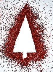 Silhouette of a Christmas tree made of red sequins