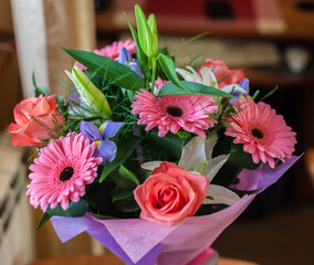 Bouquet with roses, gerberas, lilies and irises