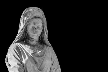 Fragment of an ancient stone statue of sad and desperate woman on tomb as a symbol of death and the end of human life. Isolated on black background.