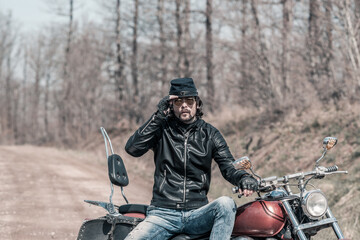 Biker portrait. Photo with a motorcycle