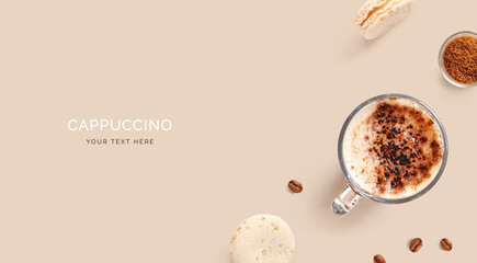 Creative layout made of cups of cappuccino, macaroons, coffee beans and brown sugar on a beige background.Flat lay. Food concept.
