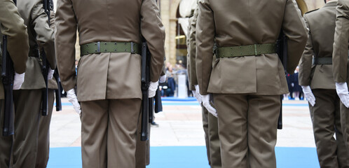 Soldiers lined up in the city square before performing the ceremony - The Army soldiers standing in row they are wearing and wear military uniforms - Concept of patriotism and defense of the nation