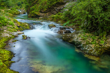Breathtaking view over colorful Radovna river in Vintgar Gorge, Slovenia.  Long exposure.