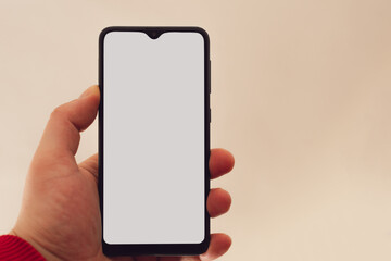 hand holding smartphone white screen mock up