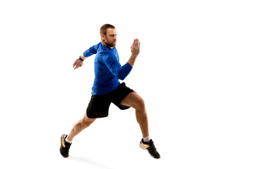 Fototapeta na wymiar Power. Caucasian professional jogger, runner training isolated on white studio background. Muscular, sportive man, emotional. Concept of action, motion, youth, healthy lifestyle. Copyspace for ad.