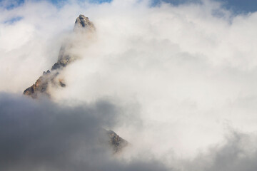 Naklejka na ściany i meble dramatic sky on mountain peaks of italian alps