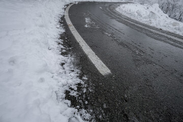 snow-covered curved road close-up. Transportation. Top view