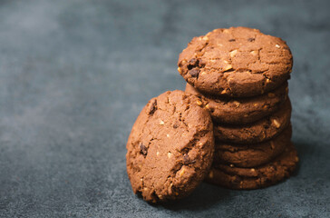 Cookies with hazelnuts and chocolate, dark moody sweets, empty copy space for text