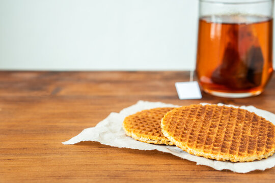 Traditional local signature authentic Dutch Netherlands sweet fresh homemade of delicious tasty stack brown golden waffle caramel honey sugar syrup for dessert in cafe with coffee tea call Stroopwafel