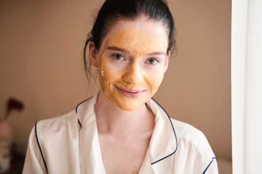 Woman with vitiligo using a face mask - Powered by Adobe