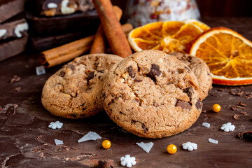 Organic food snack tasty sweet dessert milk dark chocolate chip salt cookie closeup piece fruit orange raspberry hazelnut nuts cinnamon on cocoa cacao powder wooden table for new year Christmas gift
