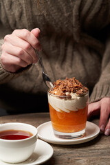 Woman eating Persimmon pudding. Woman having breakfast