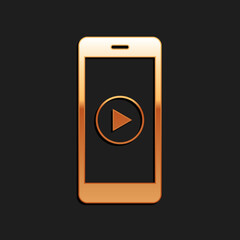 Gold Smartphone with play button on the screen icon isolated on black background. Long shadow style. Vector.