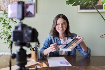 Fototapeta premium Art workshop online, teenage girl drawing with watercolors