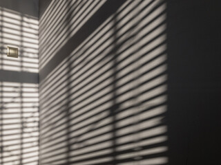 Lights shadows. Abstract light, black shadow overlay from window on white texture wall. Sunlight architecture background. Textures Light reflection from the window.