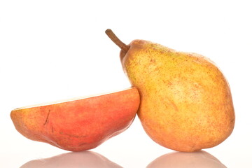 One whole and one half of a red pear, close-up, isolated on white.