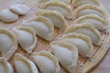 Freshly wrapped dumplings close up. Chinese food.