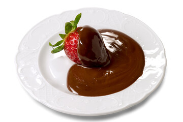 strawberry covered with melted dark chocolate in white saucer isolated on white