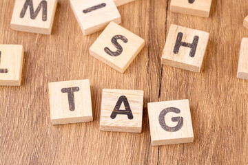Wooden alphabet with "tag" write