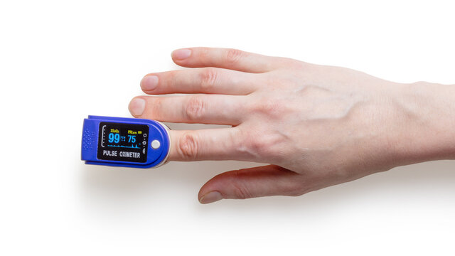 Clean medical oximeter with hand on white background