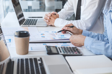 Teamwork of business colleagues consultation market growth on financial document graph report...