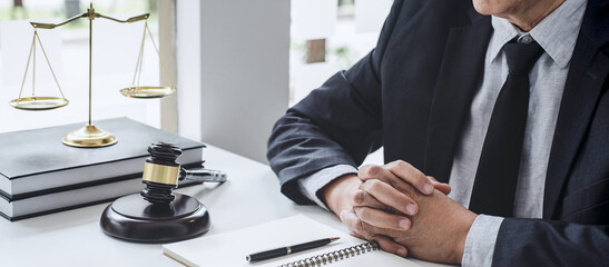 Judge gavel with Justice lawyers, Counselor in suit or lawyer working  with contract papers on a documents in courtroom, Legal law, advice and justice concept