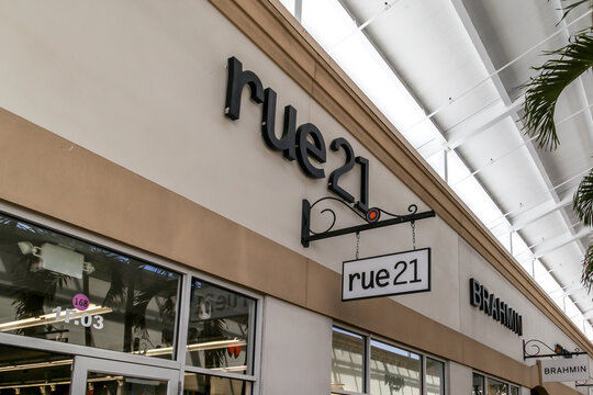 Orlando, Florida, USA- February 5, 2020: Rue21 sign outside of the store in Orlando, Florida, USA; Rue21 is an American specialty retailer of women's casual apparel and accessories.