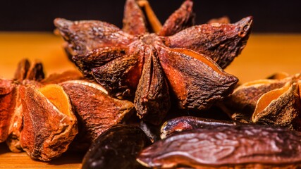 Tonka Beans and Star Anise on a dark background