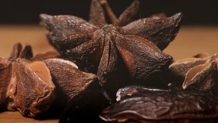 Tonka Beans and Star Anise on a dark background