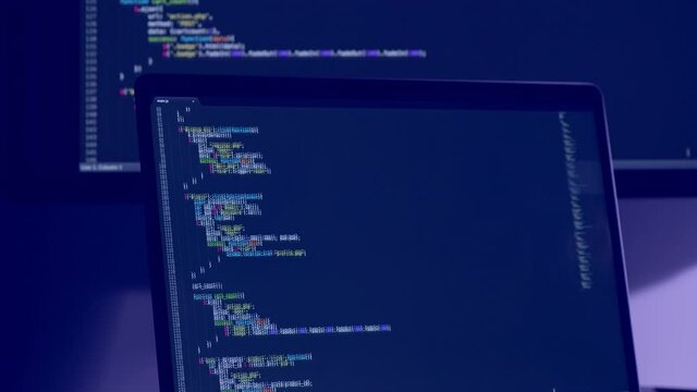 Real Javascript code. Front end web development. Java script JS code on laptop screen. Web design concept.