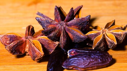 Tonka Beans and Star Anise on a dark background