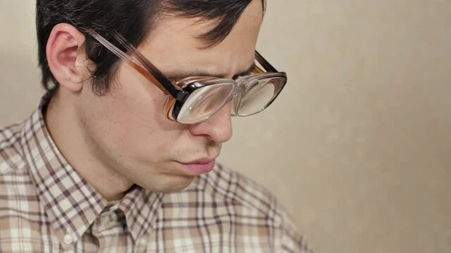 Nerd wearing two pair of glasses