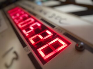 Macro detail of red timecode numbers on a film slate (clapperboard), extremely shallow depth of field