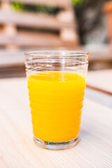 Delicious orange juice freshly pressed from organic oranges. Vertical shot.