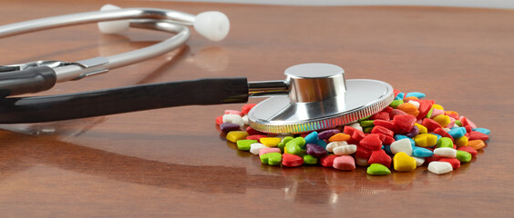 picture of pills and stethoscope on the table