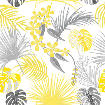 Seamless pattern of ultimate gray tropical leaves of palm tree and illuminating yellow flowers