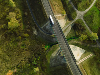 Aerial Top View of White Truck with Cargo Semi Trailer Moving on