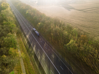 Aerial Top View of White Truck with Cargo Semi Trailer Moving on