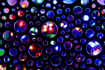 Background of abstract circles illuminated with multicoloured flashlight.