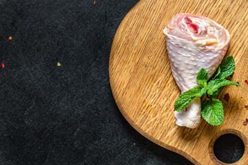 Chicken leg raw meat skin bones broiler fresh piece ready to eat on the table healthy meal snack ingredient top view copy space for text food background rustic