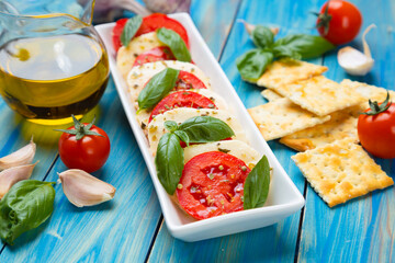 Italian caprese salad with mozzarella cheese