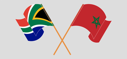 Crossed and waving flags of Republic of South Africa and Morocco