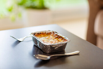Chicken Lasagna on table with spoon and fork