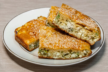 homemade pie with feta cheese and herbs close up
