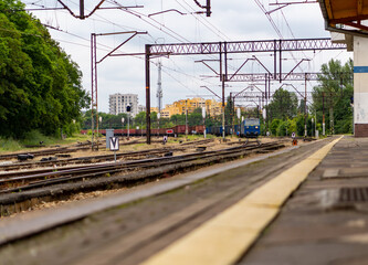 Fototapeta premium An old railway depot, trains in the background with all the infrastructure.