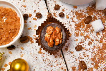 sweet food top view background for merry christmas or new year holiday decoration - chocolate candies, tangerines, cookies on white wood