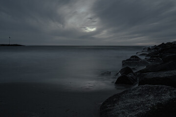 Seashore with a long exposure time, black and white photo.