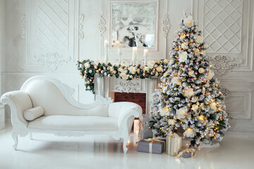 Christmas and New Year decorated luxury interior of living room with fireplace, sofa and New year tree in white classic style. Space for text